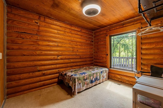 1000 N Canadian Ave, Purcell, OK 73080 - carpeted bedroom with log walls, wooden ceiling, and access to outside