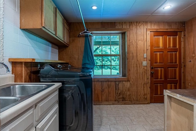1000 N Canadian Ave, Purcell, OK 73080 - washroom featuring cabinet space, wood walls, independent washer and dryer, recessed lighting, and light tile patterned flooring
