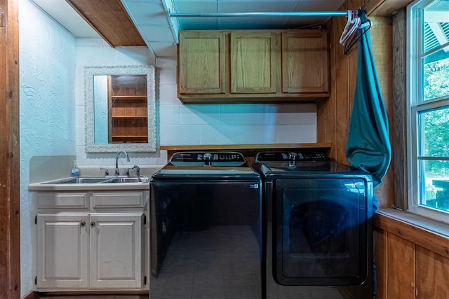 1000 N Canadian Ave, Purcell, OK 73080 - laundry room featuring washer and dryer, cabinet space, and a textured wall