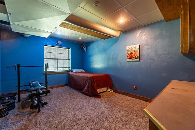 1000 N Canadian Ave, Purcell, OK 73080 - carpeted bedroom with a paneled ceiling and baseboards
