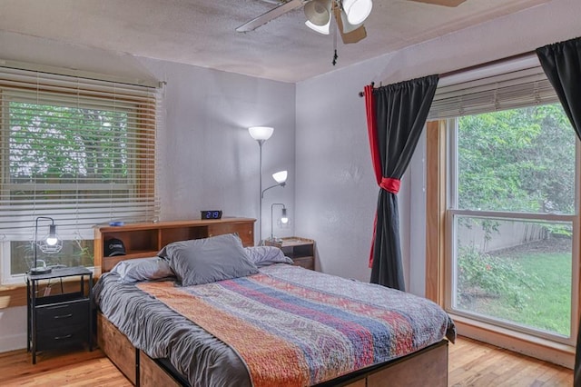 912 E Comanche St, Norman, OK 73071 - bedroom featuring light wood-type flooring and a ceiling fan