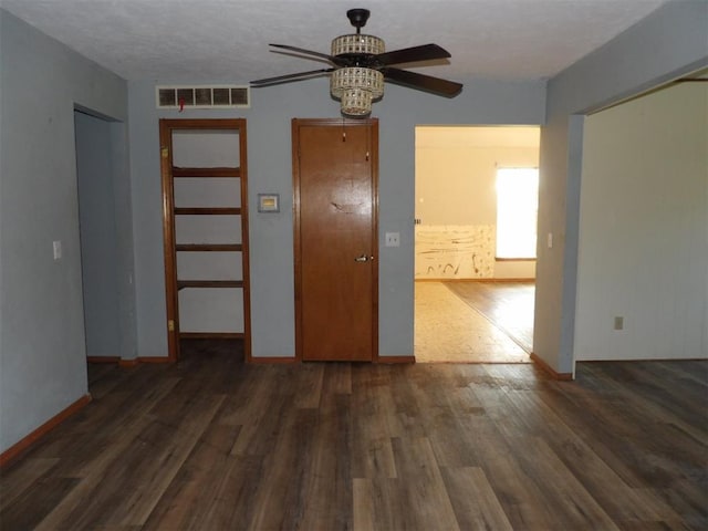 8317 NW 27th St, Bethany, OK 73008 - empty room with ceiling fan, wood finished floors, and baseboards