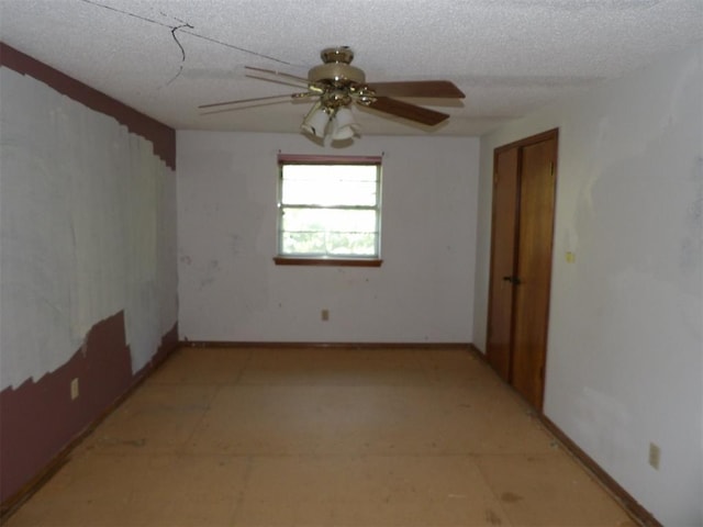 8317 NW 27th St, Bethany, OK 73008 - unfurnished room with ceiling fan, a textured ceiling, and baseboards