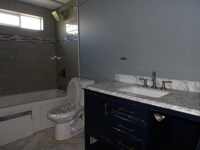 8317 NW 27th St, Bethany, OK 73008 - bathroom with toilet, vanity, and bathtub / shower combination