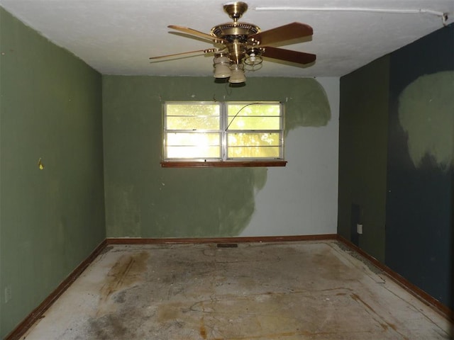 8317 NW 27th St, Bethany, OK 73008 - unfurnished room with baseboards and a ceiling fan