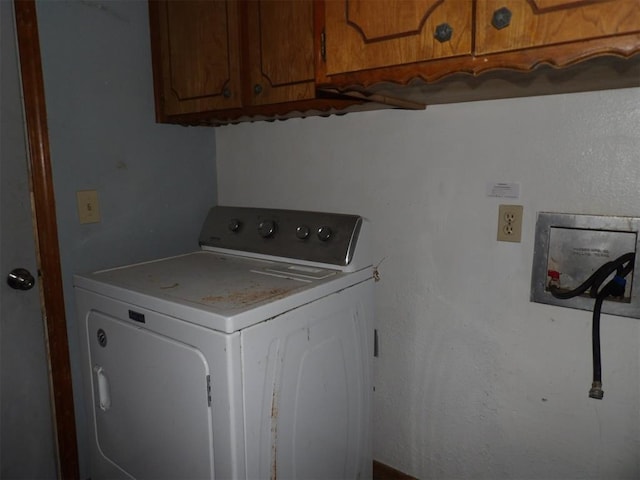 8317 NW 27th St, Bethany, OK 73008 - laundry area featuring washer / dryer and cabinet space