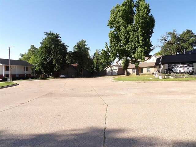 8317 NW 27th St, Bethany, OK 73008 - view of concrete street with a residential view and curbs