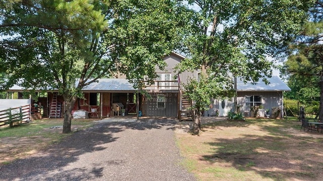 2645 E 2090th Rd, Hugo, OK 74743 - view of front facade with stairway and board and batten siding