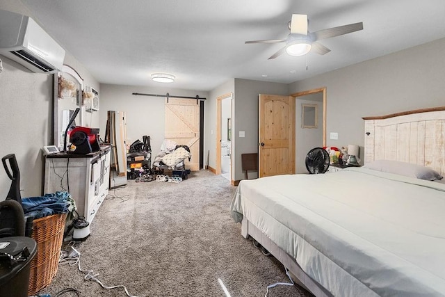 2645 E 2090th Rd, Hugo, OK 74743 - bedroom with a wall mounted air conditioner, a barn door, carpet floors, and ceiling fan