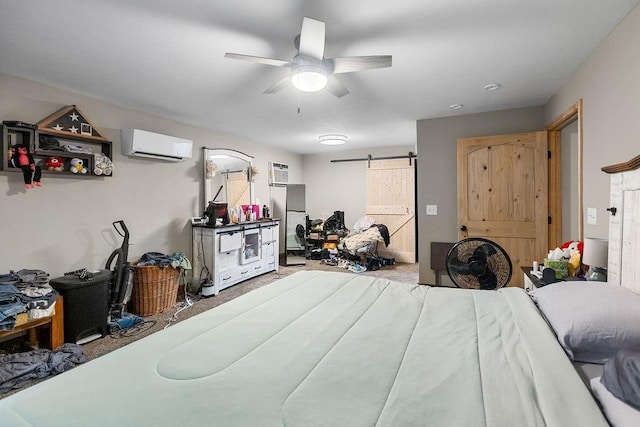 2645 E 2090th Rd, Hugo, OK 74743 - bedroom with an AC wall unit, a barn door, carpet floors, a ceiling fan, and a wall mounted AC