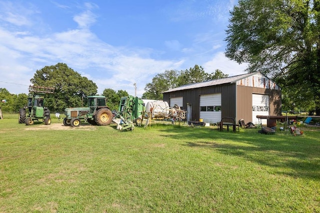 2645 E 2090th Rd, Hugo, OK 74743 - view of grassy yard featuring a detached garage and an outbuilding