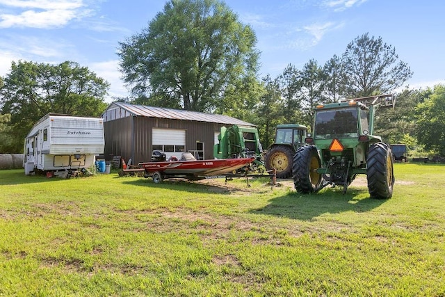 2645 E 2090th Rd, Hugo, OK 74743 - view of grassy yard with an outdoor structure and a garage