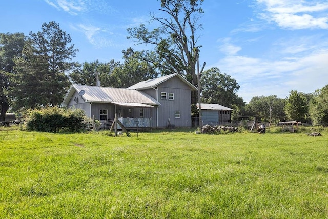 2645 E 2090th Rd, Hugo, OK 74743 - back of property featuring a lawn and metal roof