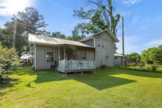 2645 E 2090th Rd, Hugo, OK 74743 - back of house featuring board and batten siding, metal roof, and a wooden deck
