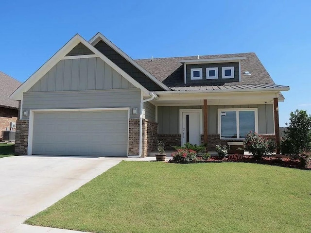 8332 NW 139 Th Ter, Oklahoma City, OK 73142 - craftsman house featuring board and batten siding, a front yard, brick siding, an attached garage, and concrete driveway