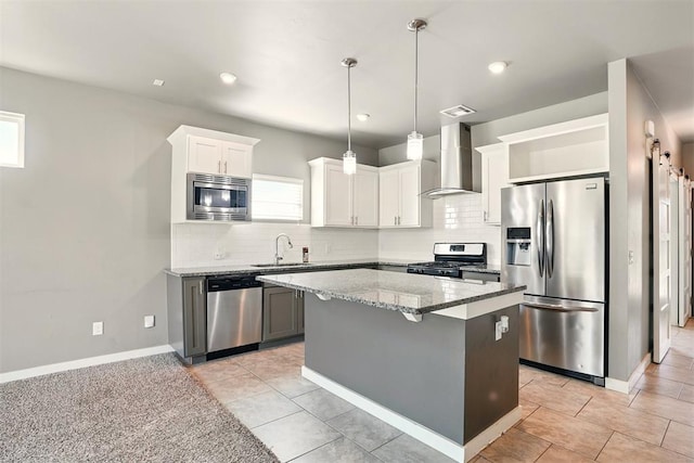 8332 NW 139 Th Ter, Oklahoma City, OK 73142 - kitchen with stainless steel appliances, wall chimney range hood, a sink, light stone counters, and backsplash
