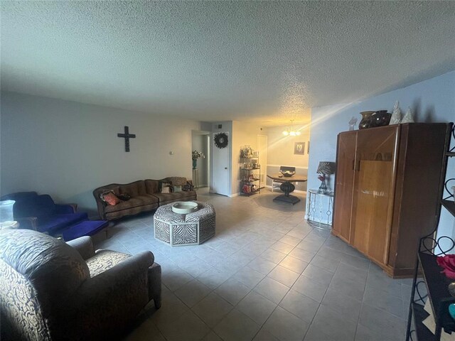 tiled living area featuring a textured ceiling