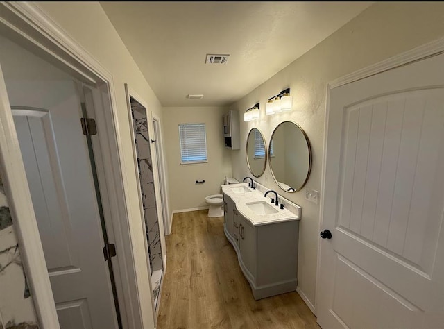5000 SE 85th St, Oklahoma City, OK 73135 - full bath with toilet, wood finished floors, double vanity, and baseboards