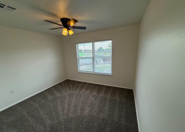 5000 SE 85th St, Oklahoma City, OK 73135 - empty room featuring dark carpet, baseboards, and ceiling fan