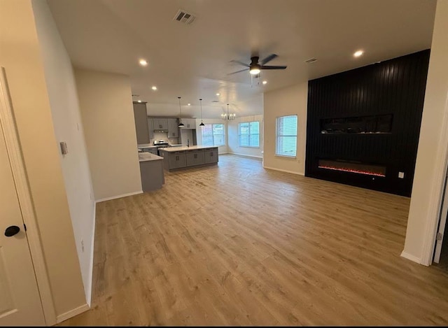 5000 SE 85th St, Oklahoma City, OK 73135 - unfurnished living room with ceiling fan, light wood finished floors, baseboards, recessed lighting, and a large fireplace