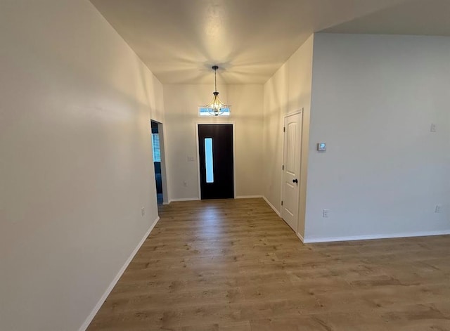 5000 SE 85th St, Oklahoma City, OK 73135 - foyer with wood finished floors, baseboards, a chandelier, and a towering ceiling