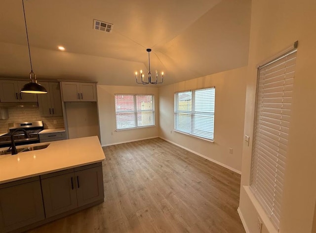 5000 SE 85th St, Oklahoma City, OK 73135 - unfurnished dining area featuring a sink, a chandelier, baseboards, light wood finished floors, and lofted ceiling