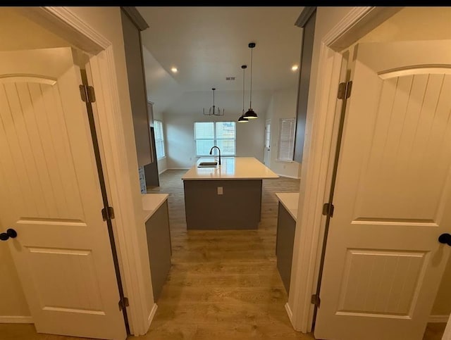 5000 SE 85th St, Oklahoma City, OK 73135 - kitchen featuring a sink, light wood finished floors, a center island with sink, light countertops, and recessed lighting