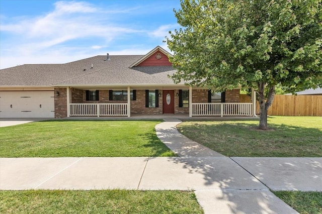 2900 Coventry Manor Dr, Oklahoma City, OK 73128 - view of front of property featuring a porch, a shingled roof, an attached garage, and brick siding