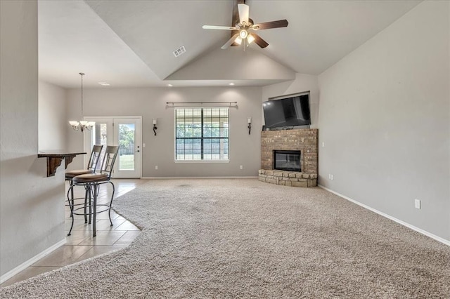 2900 Coventry Manor Dr, Oklahoma City, OK 73128 - unfurnished living room featuring ceiling fan, baseboards, a glass covered fireplace, a chandelier, and lofted ceiling