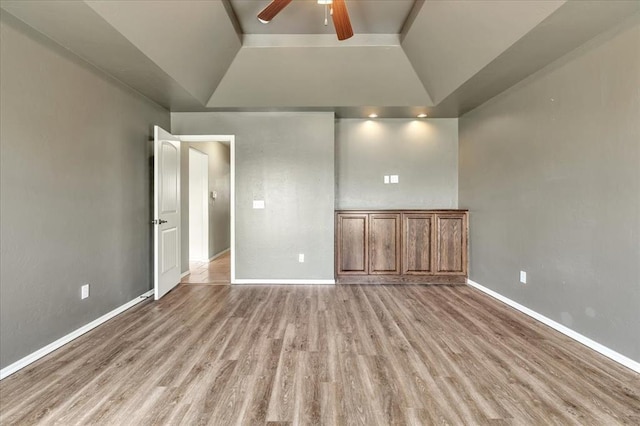 2900 Coventry Manor Dr, Oklahoma City, OK 73128 - unfurnished bedroom featuring light wood finished floors, baseboards, vaulted ceiling, and ceiling fan