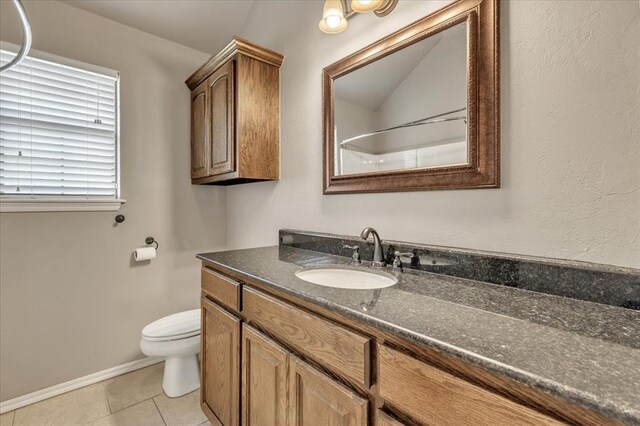 2900 Coventry Manor Dr, Oklahoma City, OK 73128 - bathroom with vanity, toilet, baseboards, and tile patterned flooring