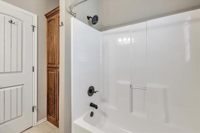 2900 Coventry Manor Dr, Oklahoma City, OK 73128 - bathroom with shower / bathtub combination, tile patterned flooring, and baseboards