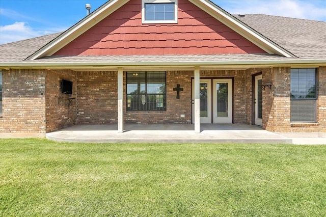 2900 Coventry Manor Dr, Oklahoma City, OK 73128 - back of house featuring brick siding, a yard, and roof with shingles