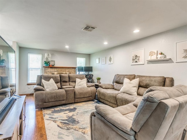 625 Jasmine Pl, Edmond, OK 73003 - living area featuring wood finished floors, plenty of natural light, and recessed lighting