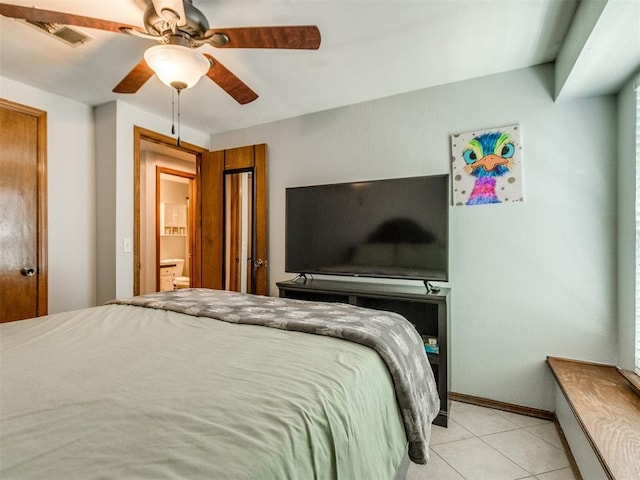 625 Jasmine Pl, Edmond, OK 73003 - bedroom with light tile patterned floors, a ceiling fan, and baseboards