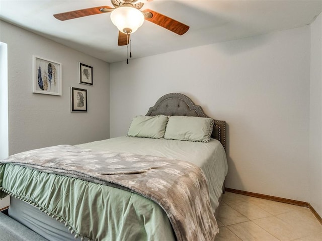 625 Jasmine Pl, Edmond, OK 73003 - bedroom featuring baseboards, light tile patterned floors, and ceiling fan
