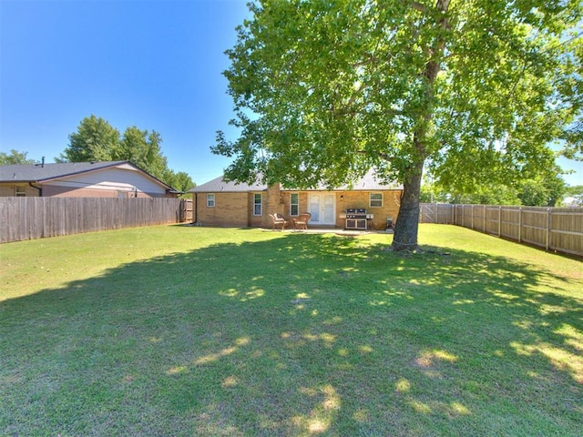 625 Jasmine Pl, Edmond, OK 73003 - view of yard featuring french doors and a patio