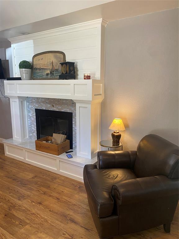 308 Jeffrey Laird Pl, Moore, OK 73160 - detailed view of wood finished floors and a fireplace