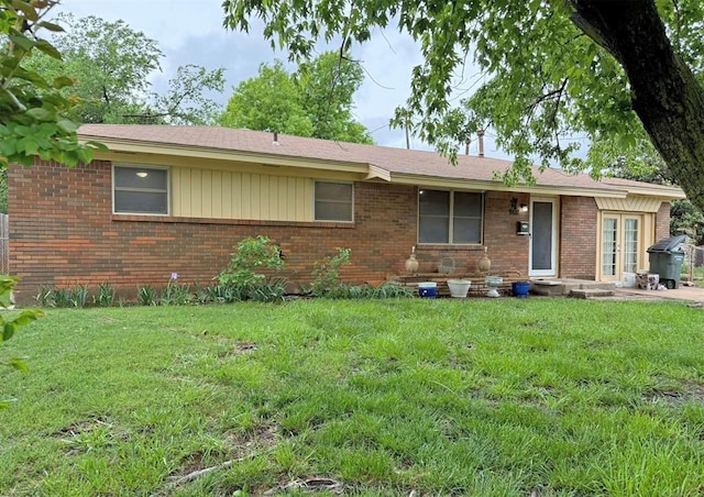2405 S Mansfield St, Del City, OK 73115 - single story home featuring brick siding and a front yard