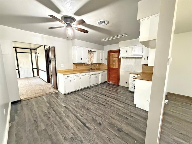 2405 S Mansfield St, Del City, OK 73115 - kitchen with a sink, ceiling fan, dark wood finished floors, and tasteful backsplash