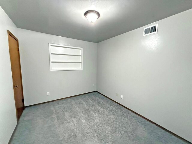 2405 S Mansfield St, Del City, OK 73115 - empty room with carpet flooring and baseboards