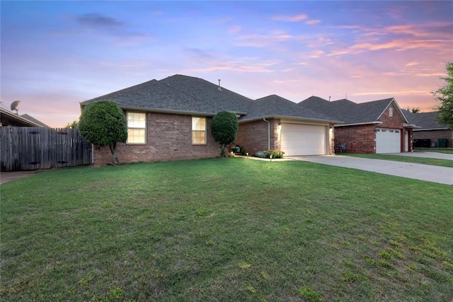 7713 Geneva Rea Ln, Yukon, OK 73099 - view of front of property with an attached garage, brick siding, driveway, and a shingled roof