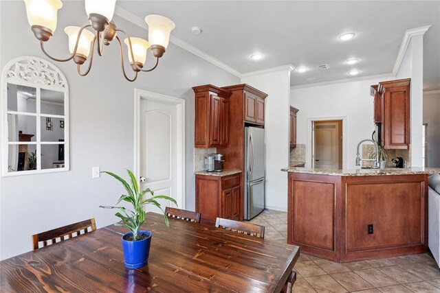 7713 Geneva Rea Ln, Yukon, OK 73099 - dining space featuring a chandelier, crown molding, light tile patterned floors, and recessed lighting