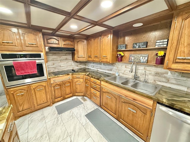 129 Park Dr, Sayre, OK 73662 - kitchen with appliances with stainless steel finishes, a sink, brown cabinets, tasteful backsplash, and open shelves