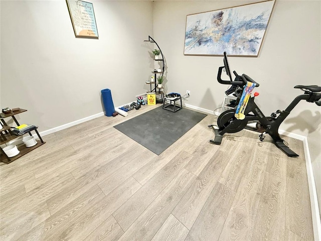 129 Park Dr, Sayre, OK 73662 - exercise room with wood finished floors and baseboards