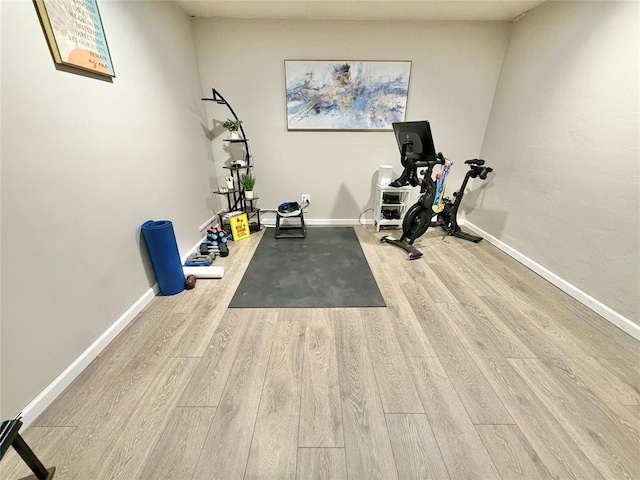 129 Park Dr, Sayre, OK 73662 - exercise room with wood finished floors and baseboards
