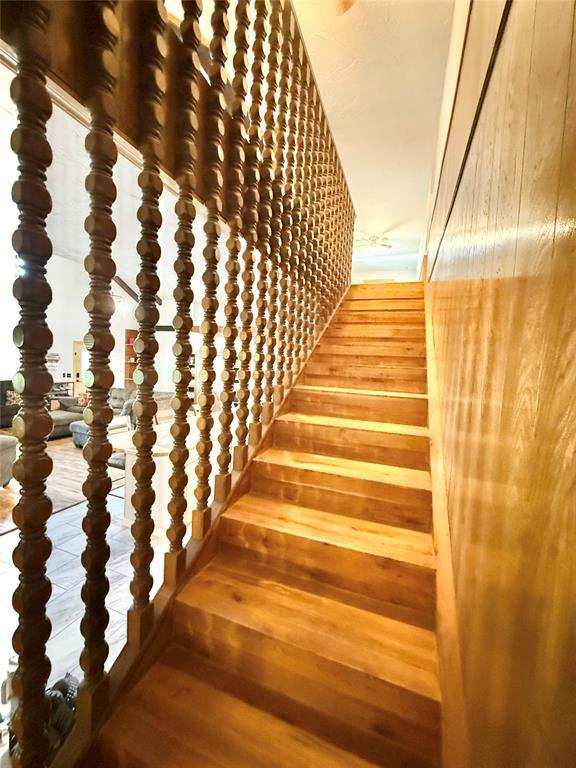 129 Park Dr, Sayre, OK 73662 - stairs featuring wood finished floors