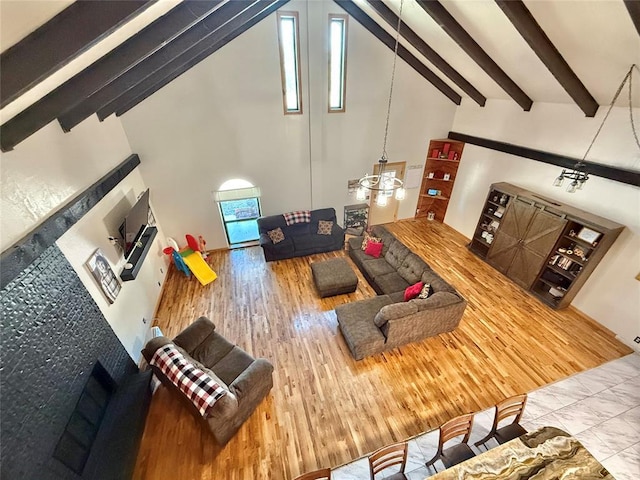 129 Park Dr, Sayre, OK 73662 - living area featuring high vaulted ceiling, wood finished floors, and beamed ceiling