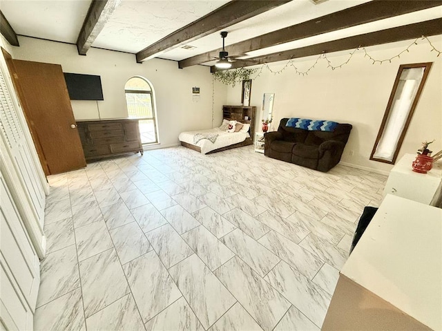 129 Park Dr, Sayre, OK 73662 - bedroom featuring light marble finish floors, baseboards, beamed ceiling, and a ceiling fan