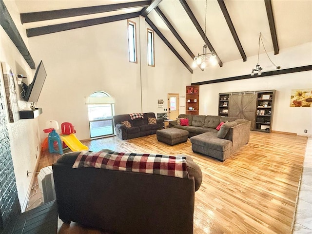 129 Park Dr, Sayre, OK 73662 - living room featuring high vaulted ceiling, wood finished floors, and beam ceiling